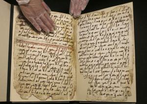 A fragment of a Koran manuscript is seen in the library at the University of Birmingham in Britain July 22, 2015. A British university said on Wednesday that fragments of a Koran manuscript found in its library were from one of the oldest surviving copies of the Islamic text in the world, possibly written by someone who might have known Prophet Mohammad. Radiocarbon dating indicated that the parchment folios held by the University of Birmingham in central England were at least 1,370 years old, which would make them one of the earliest written forms of the Islamic holy book in existence.  REUTERS/Peter Nicholls TPX IMAGES OF THE DAY