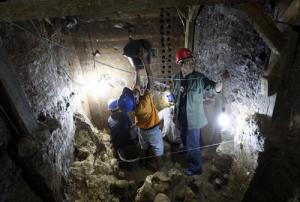 **   FOR RELEASE SUNDAY, MARCH 7, AND THEREAFTER **   In this photo taken Sept. 14, 2009, workers labor at the Liang Bua cave excavation site where the remains of Homo floresiensis were discovered in Ruteng, Flores island in Indonesia. This world turned upside down may once have existed on the remote island of Flores, where an international team is trying to shed light on the fossilized 18,000-year-old skeleton of a dwarf cavewoman whose discovery in 2003 was an international sensation. (AP Photo/ Achmad Ibrahim)